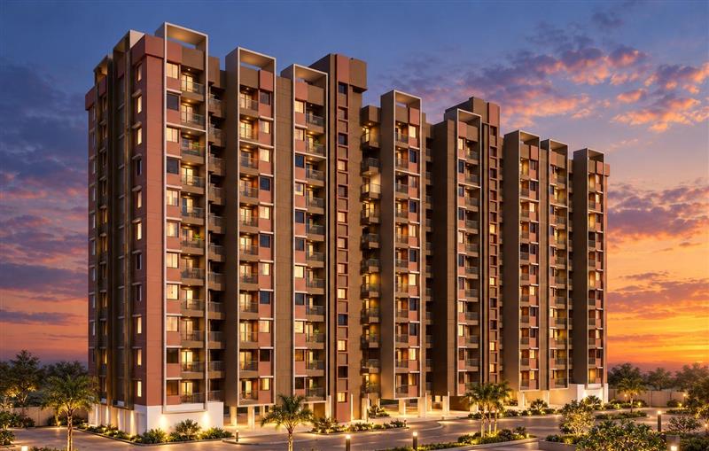 Illustrative render at dusk of a long residential building of linked towers in terracotta and brown with lit windows and balconies, palm-lined driveways and landscaped gardens under an orange sky