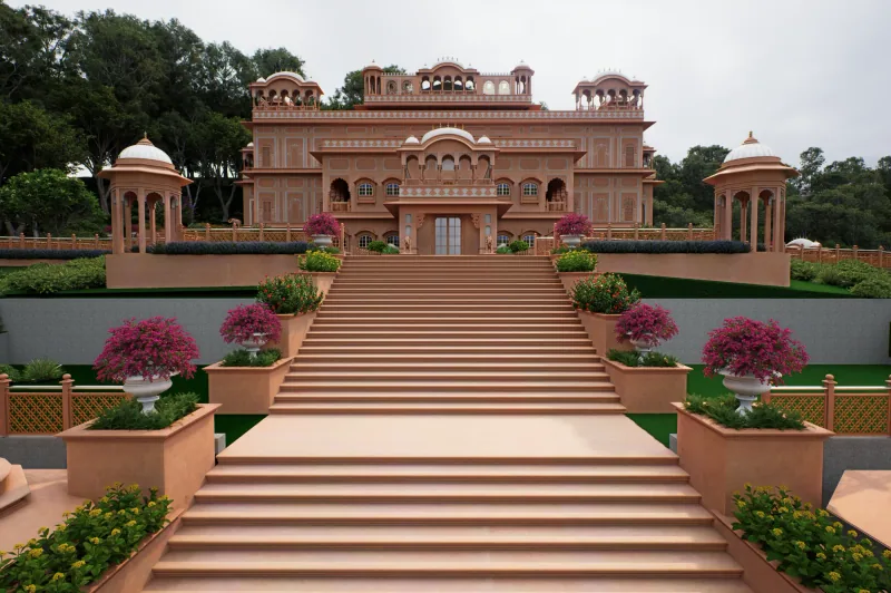 Illustrative render of a pink sandstone Rajasthani-style building with domed pavilions, approached by a wide stone staircase with flower planters