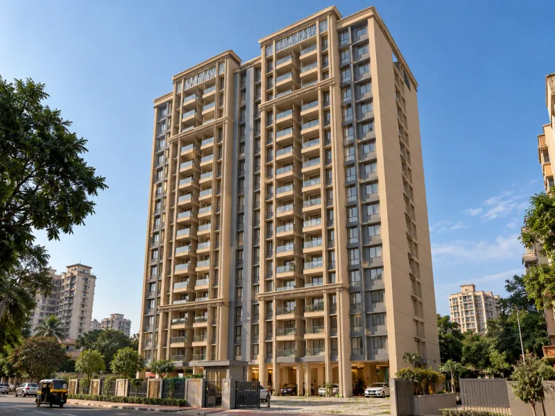 Illustrative image of a tall beige residential tower with glass-railed balconies under a clear blue sky, a gated entrance with parking under the building and trees along the street